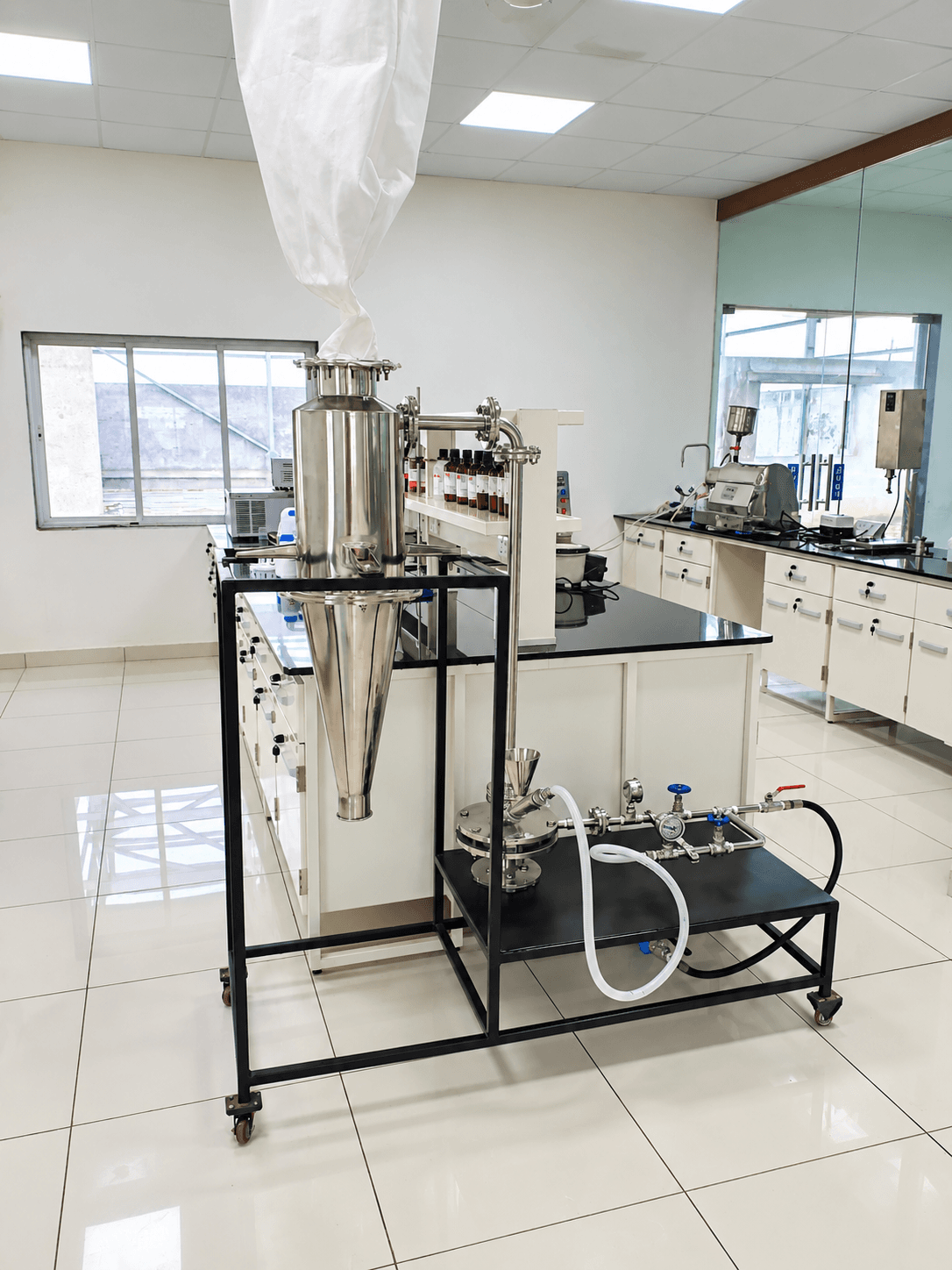 Technician operating a formulation reactor